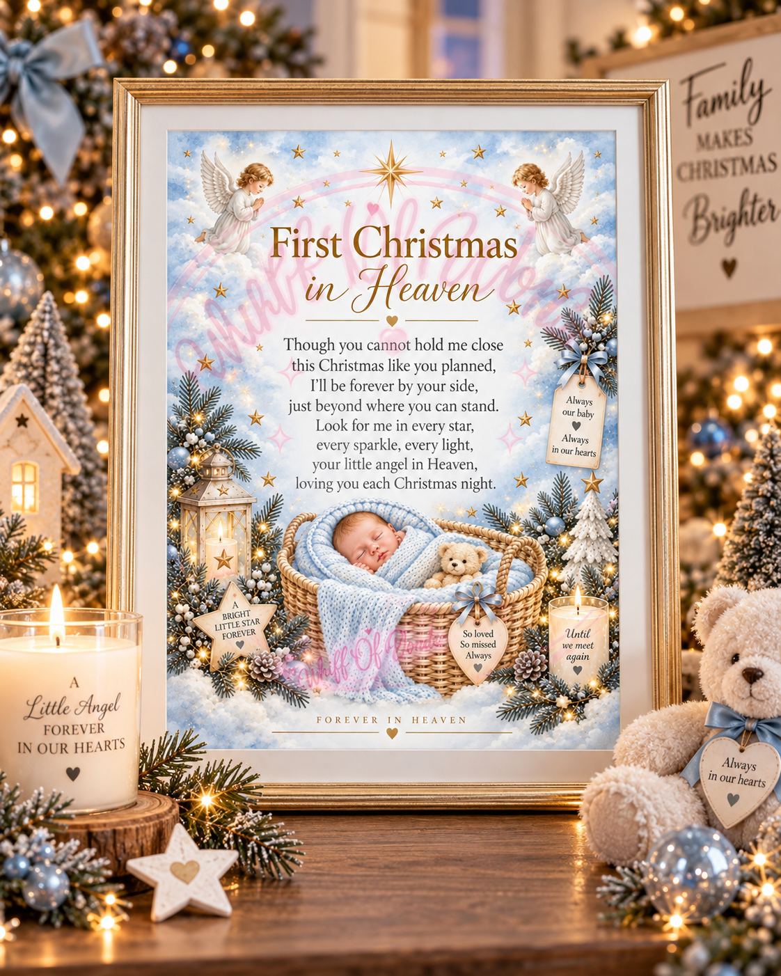 Framed blue Baby's First Christmas in Heaven memorial print with a sleeping baby, displayed beside Christmas decorations.