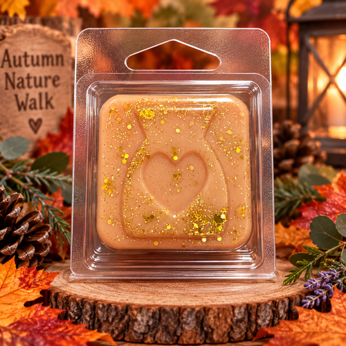 Peach Autumn Nature Walk sample wax melt with a heart design and gold flecks in a woodland-inspired display.