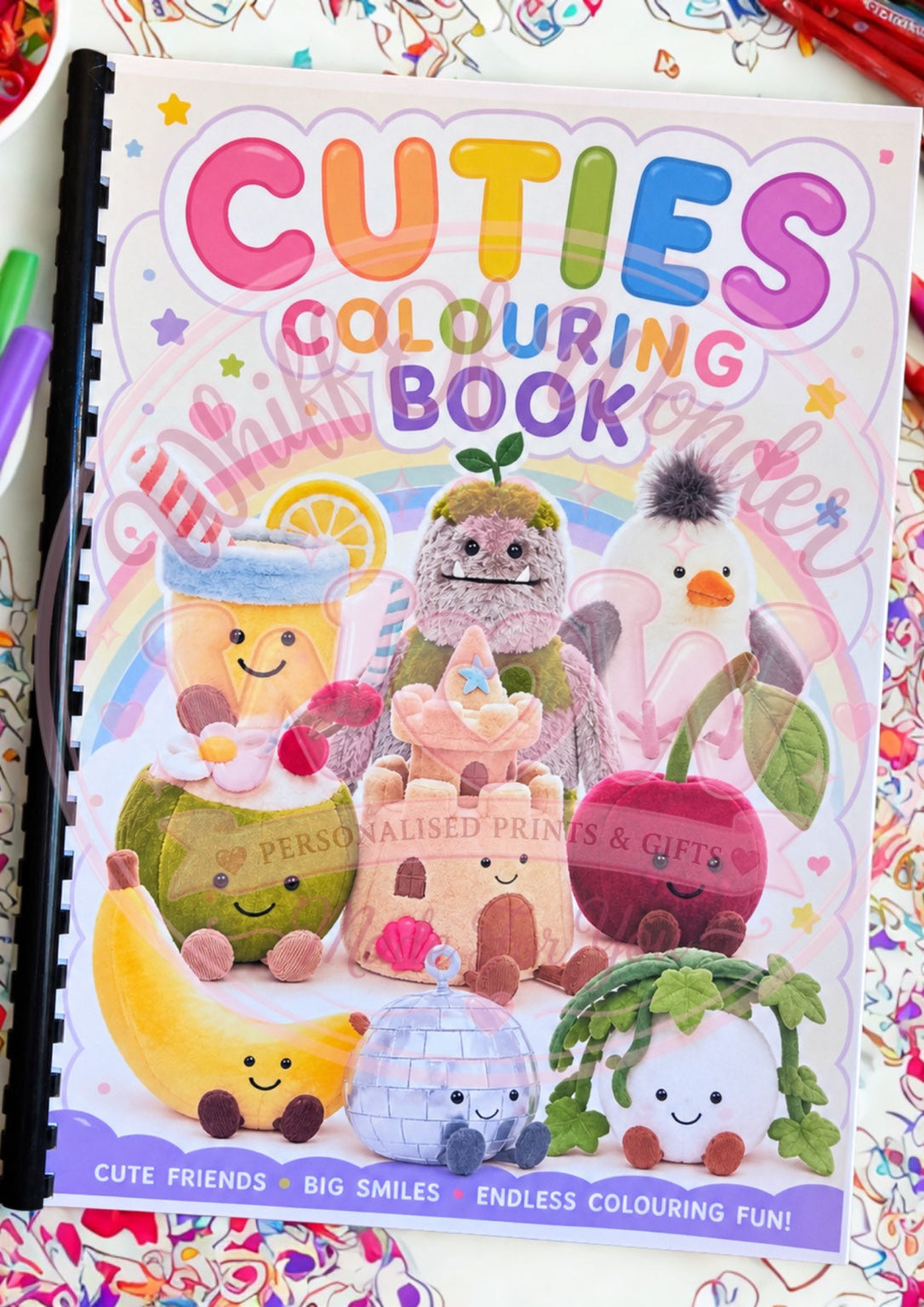 Cuties colouring book cover with smiling pastel food, castle and accessory characters.